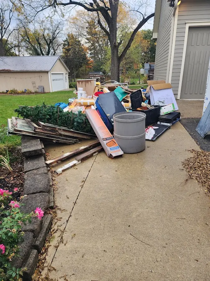 Dumpster being loaded with debris for Demolition Dumpster Rental in Bronxville